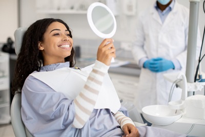 Smiling woman with straight, white teeth.